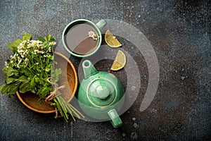 Herbal tea with natural healing medical herbs, tea cup, tea pot top view