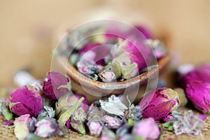 Herbal Tea Roses with Wooden Spoon Up Close