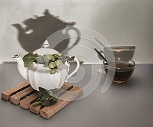 Herbal tea with sage in a teapot and Cup