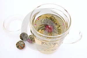 Herbal tea with tea flower in glass cup