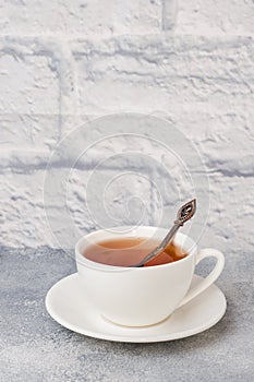 Herbal tea in a white Cup. Gray background with copy space