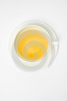 Herbal tea in a white cup isolated on white