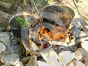 Herbal tea from wild herbs during cooking on open fire