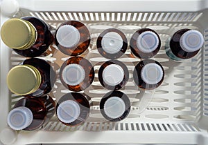 Herbal tinctures, antiseptics and other liquid medicines in vials. View from above. Medical background with medicines