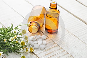 Herbs and bottle with medicines. Concept homeopathy.