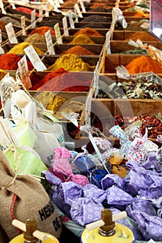 Herbs in colorful handmade pouches and spices at French market