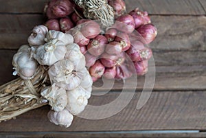 Herbs garlic food ingredients on wood