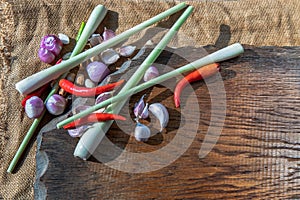 Herbs and ingredient mixed Lemon Grass, Shallot, Garlic, Chili on wooden chopping board