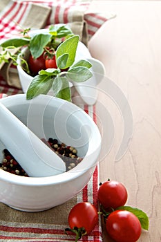 Herbs with peppercorns and tomatoes