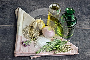 Herbs: rosemary, thyme, oregano, sea salt, olive oil bottles, ga