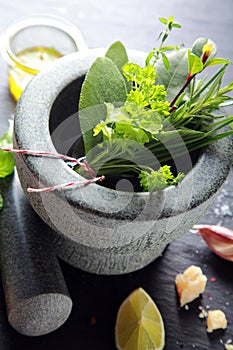 Herbs on Stone Mortar and Pestle