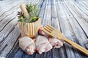 Herbs and thighs Raw chicken