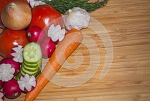 Herbs and vegetables with a blank chopping board. Space for copy.