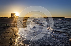 Sunset on the beach WarnemÃÂ¼nde on the Baltic Sea photo