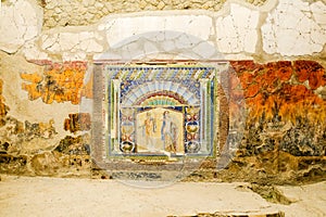 Herculaneum, ancient Roman town. Wall with ancient Roman mosaic with Neptune and Amphitrite. Archeological site, Ercolano, Italy