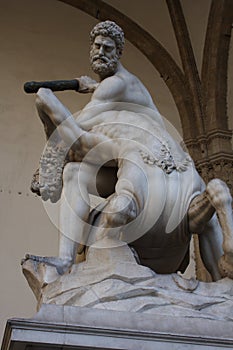 Hercules fighting with centaur Nessus, a mythological tale. This sculpture is a masterpiece of Giambologna in Florence - Italy. photo