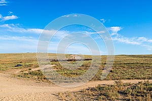 A herd of horses with the drovers on horseback in the steppes of Kazakhstan