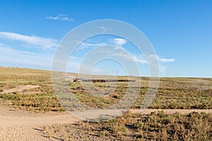 A herd of horses with the drovers on horseback in the steppes of Kazakhstan