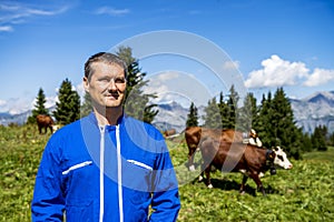 Herdsman and cows photo