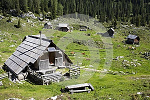 Herdsman wooden hut with solar panels, high in the mountains