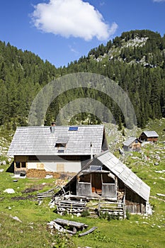 Herdsman wooden hut with solar panels, high in the mountains