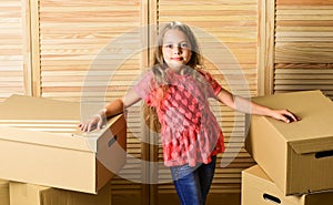 Here we are. Cardboard boxes - moving to a new house. purchase of new habitation. happy child cardboard box. repair of