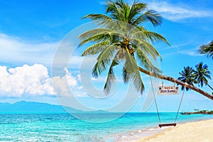 Here is Koh Samui sign and swing on palm tree, tropical island sea beach, Thailand, summer holidays, vacation, Asia travel