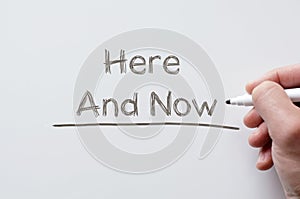 Here and now written on whiteboard