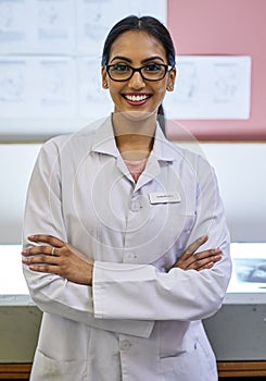 Here to ensure you never fear the dentist again. Portrait of a young female dentist standing in her office.