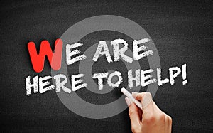 We Are Here to Help! text on blackboard