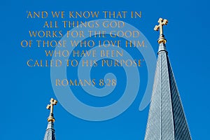Verse, Romans 8:28, with Twin Golden Crosses in the Sky photo