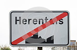 Herentals, Flanders, Belgium - Black and white sign showing the end of the urbanisation of Herentals photo
