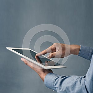 Heres the link...a man using a digital tablet against a grey background.