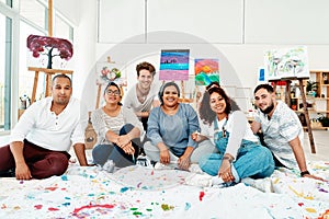 Heres to lifes greatest gift. Cropped portrait of a diverse group of friends posing together during an art class in the