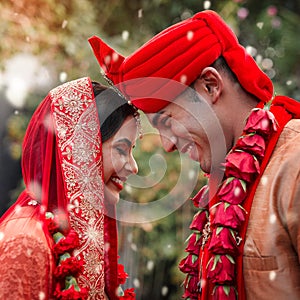 Heres to love and happily ever after. a young hindu couple on their wedding day.