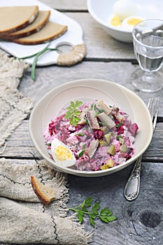 Heringssalat. Beetroot salad with herring, parsley and egg dressing