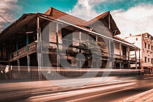 Heritage building in Indonesia, motion blur of car.