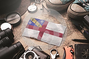 Herm Flag Between Traveler`s Accessories on Old Vintage Map. Tourist Destination Concept