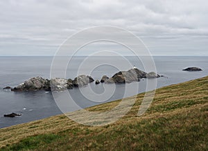 Hermaness National Nature Reserve. View on Muckle Flugga Lighthouse and Out Stack. Unst. Shetland Islands. Scotland