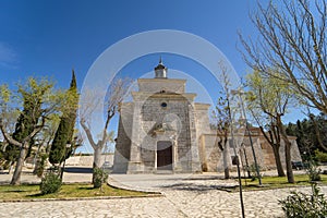 Hermitage of the Christ of the humilladero located in the town of Colmenar de Oreja on a blue day photo