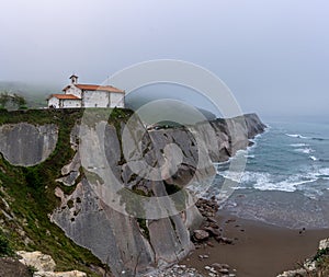 Hermitage of San Telmo with the Dragonstone cave under it in Zumaia, Basque Country