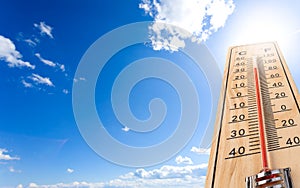 Hermometer shows the temperature is hot in the sky
