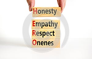 HERO honesty empathy respect oneness symbol. Concept words HERO honesty empathy respect oneness on blocks on beautiful white