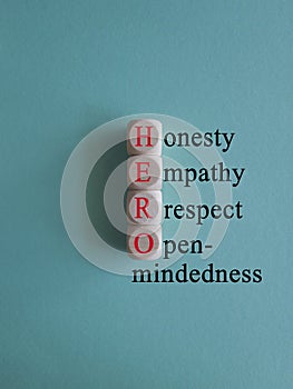 HERO honesty empathy respect open-mindedness symbol. Concept words HERO honesty empathy respect open-mindedness on wooden cubes,