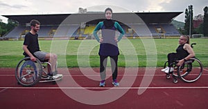 Hero portrait shot of disabled sport people whit female trainer wearing hijab after training on athletics sports track.