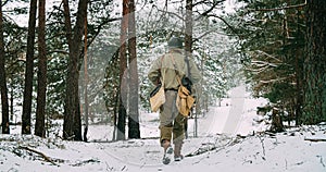 Heroes Of War. American Infantry Soldier Marching Through Forest Road In Cold Winter Day. Group Of Usa Soldiers Marching