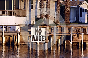 Heron on No Wake sign in Port Isabel canal