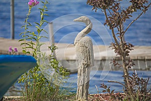 Heron statue at cottage on the Lake