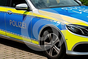 Police crowd control in the cityÃ¢â¬â¢s of Germany. Car door lettering: Polizei