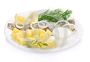 Herring and potatoes with sauce for a breakfast